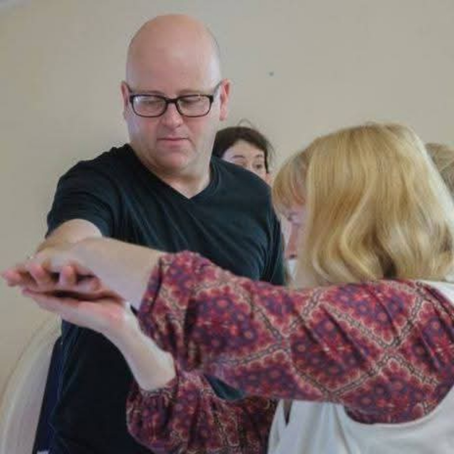 Mark taking part in a hands-on workshop with other participants